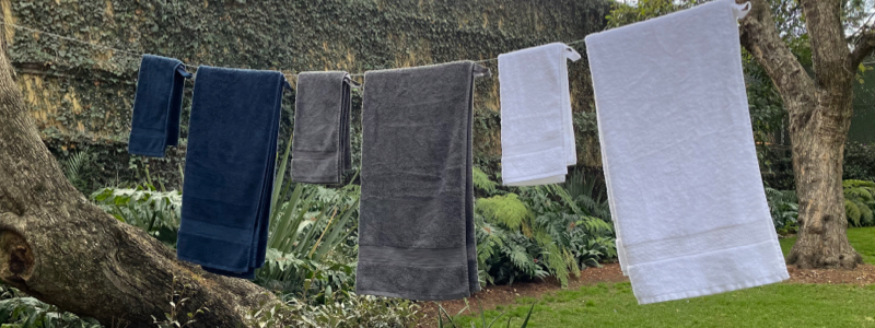 Brondell Nebia Towels hung on a clothesline in the sunshine.