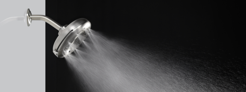 Brondell Nebia Corre Showerhead water turn on to display angel hair spray.