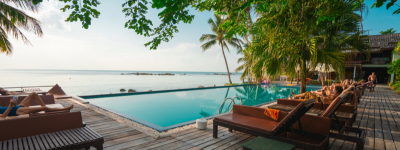 Infinity pool deck with ocean view.