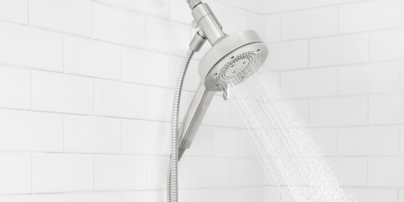 Closeup view of Nebia shower with water turned on.