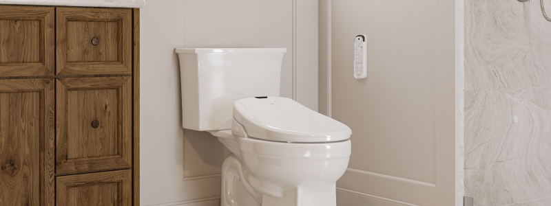 Swash 1400 Luxury Bidet Seat with Remote Control installed on a modern toilet, featuring a sleek low-profile design and wall-mounted remote in a warm, contemporary bathroom.