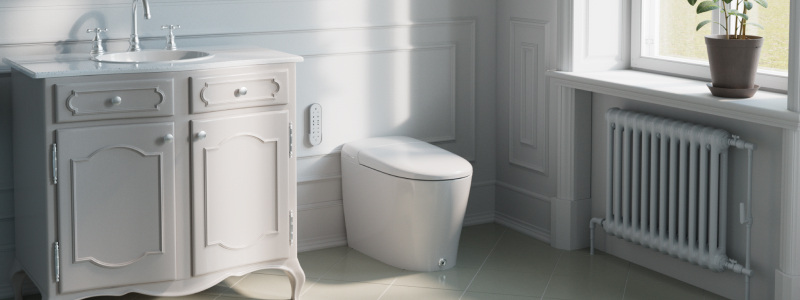 Coit Integrated Smart Bidet Toilet in a bright, elegant bathroom, featuring a sleek one-piece design, wall-mounted remote control, classic vanity, and soft natural light.