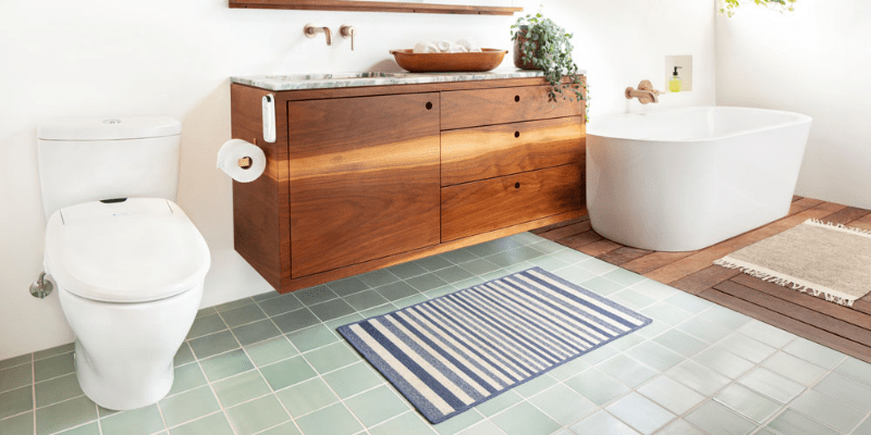 Brondell Swash 1400 Luxury Bidet Seat installed in a modern bathroom with wood accents