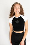 girl wearing black and white t-shirt with a star on it