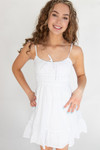 Girl wearing a white mini dress