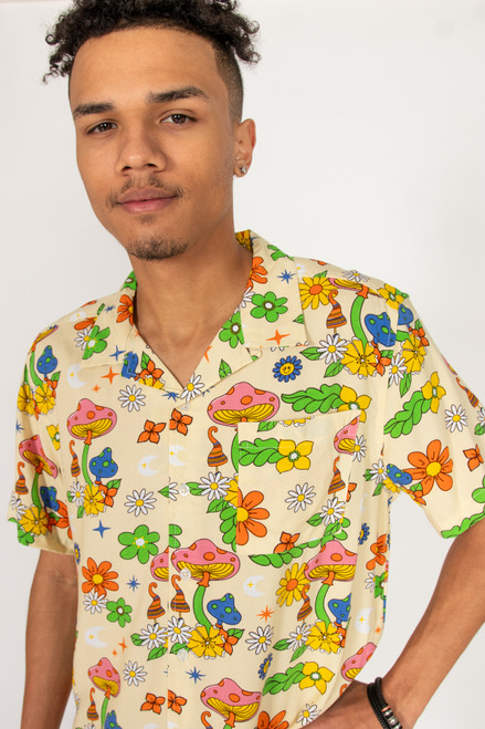 Man wearing button up shirt with colorful mushroom print