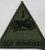 This insignia is the U.S. Army 1st Armored Division ("Old Ironsides") Subdued Shoulder Sleeve Insignia (SSI) with attached nickname tab.