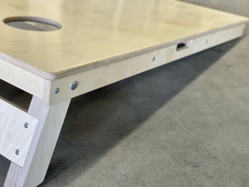 built in handle on a cornhole board