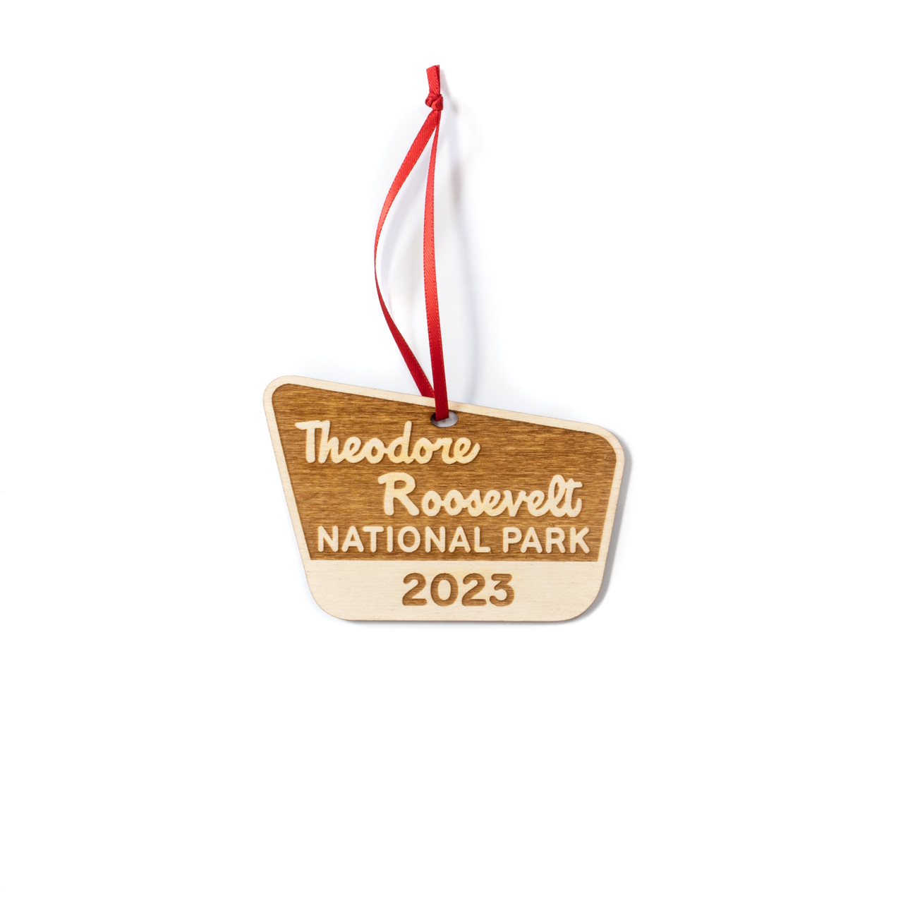 A charming engraved wooden ornament of Theodore Roosevelt National Park: A perfect souvenir to remember the stunning landscapes and natural beauty of the park.