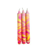 Close-up of a neon hand marbled candle, highlighting the intricate swirls of pink, orange, and yellow.