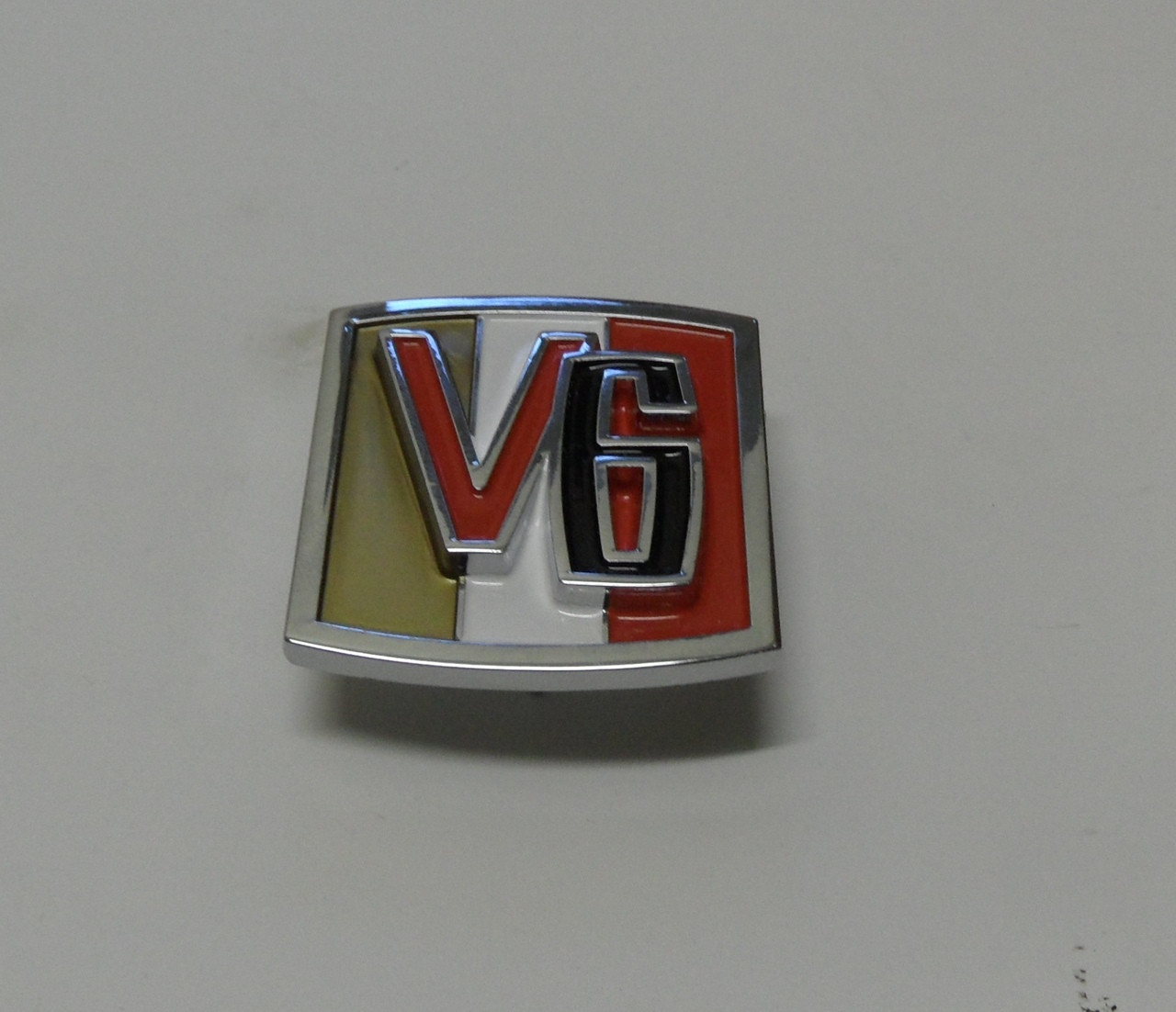 V6 emblem with mounting hardware