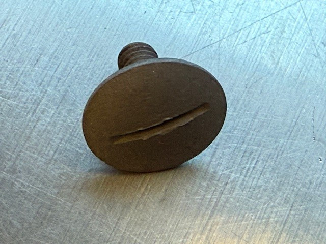 Tailgate arm stepped screw