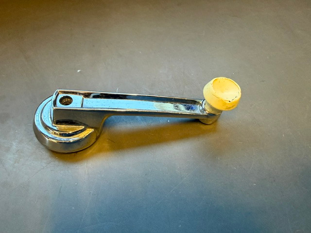 Used window crank, white knob