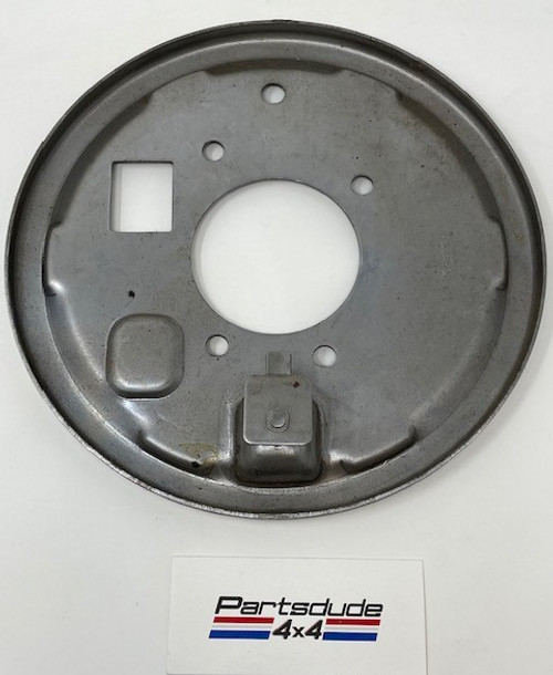 Transfer case mounted parking brake backing plate