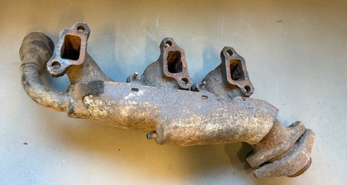 Used 1971 RH 225 V6 exhaust manifold with heat riser sheet metal