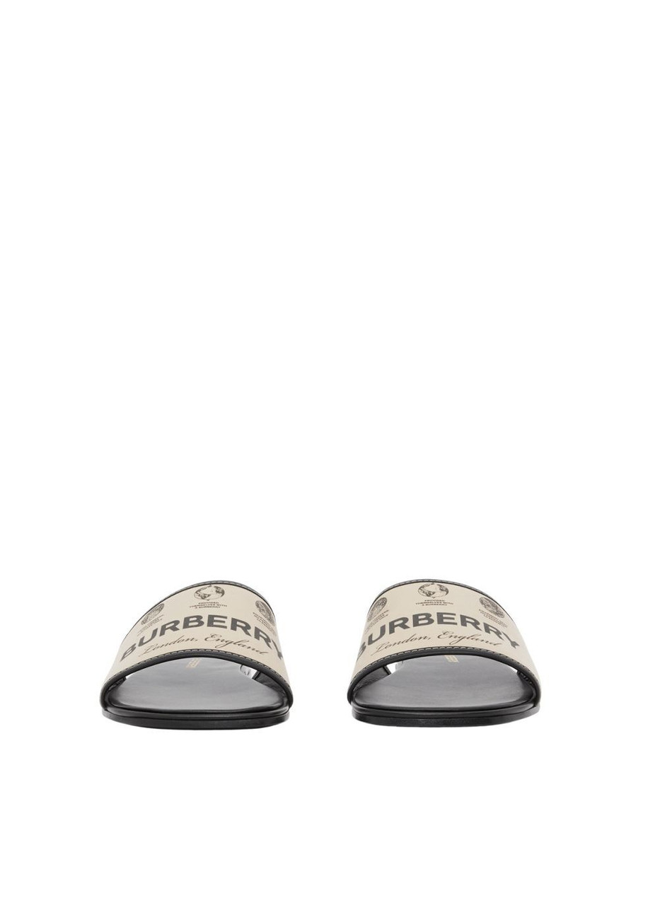 【BURBERRY】GABARDINE AND LEATHER SLIDES BURBERRY Label print gabardine and leather slides. | Harvey