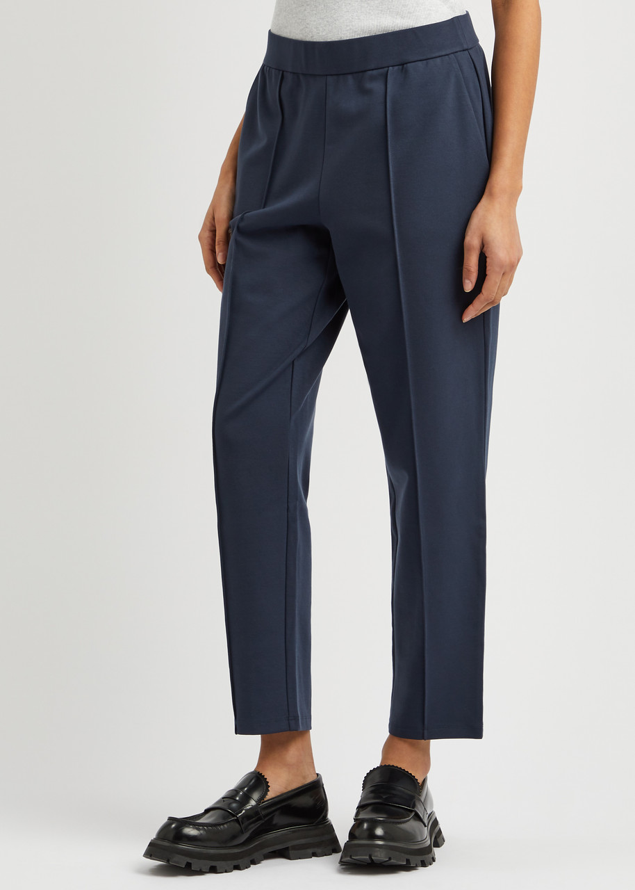 EILEEN FISHER Tapered-leg stretch-jersey trousers | Harvey Nichols