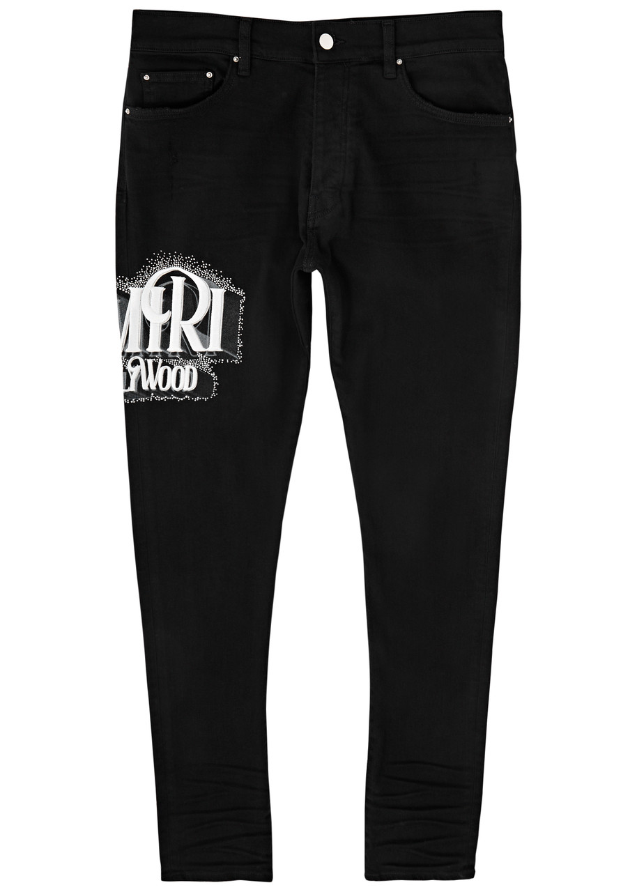 AMIRI Logo-embroidered skinny jeans | Harvey Nichols