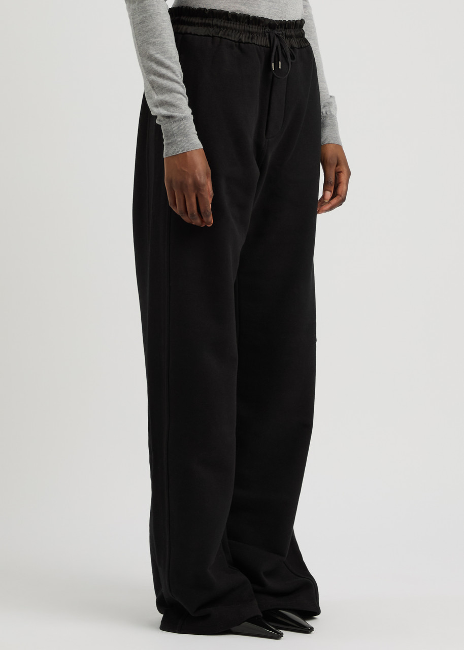 SAINT LAURENT Logo straight-leg cotton sweatpants | Harvey Nichols