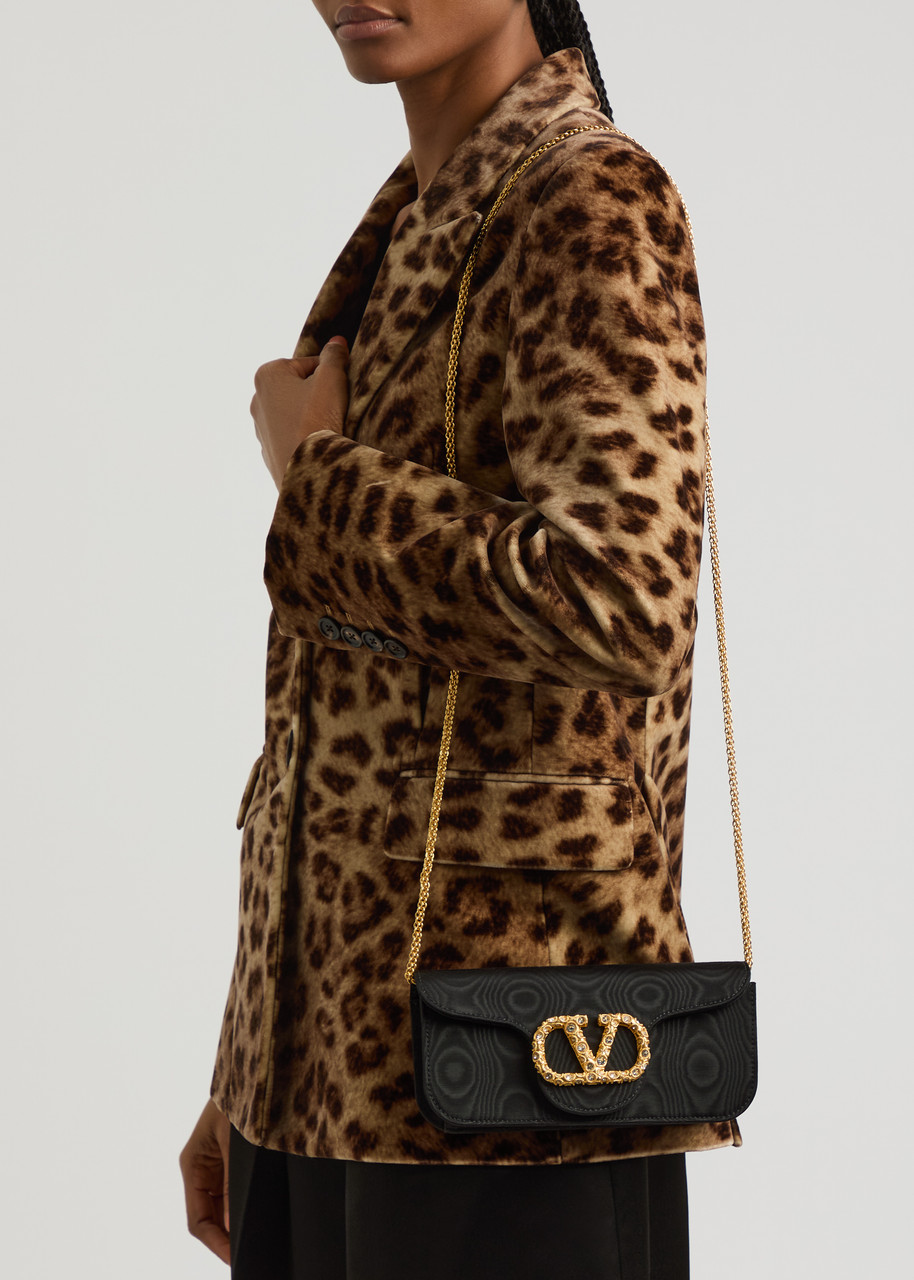 VALENTINO GARAVANI Locò logo-embellished moiré clutch | Harvey Nichols