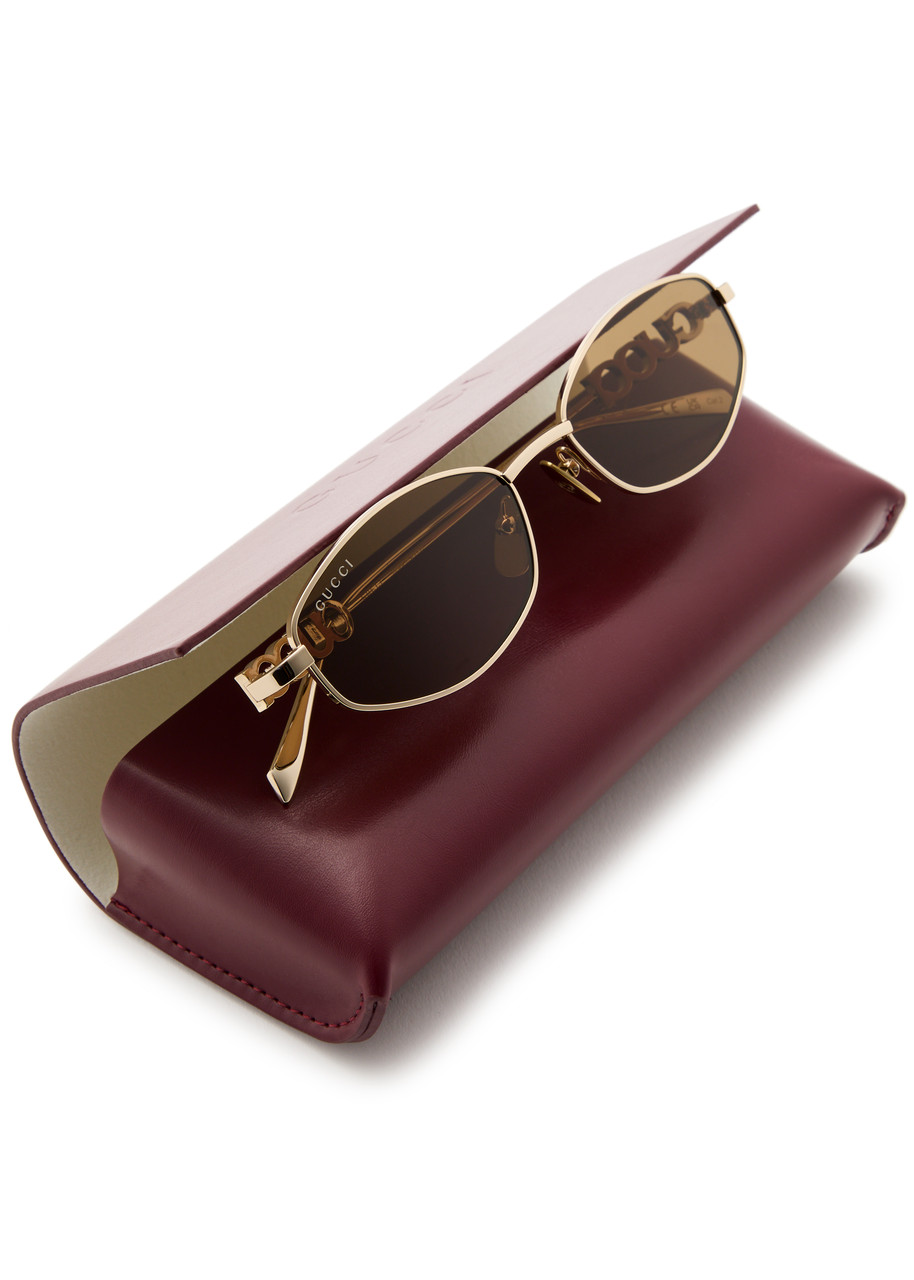 GUCCI Narrow oval-frame sunglasses | Harvey Nichols