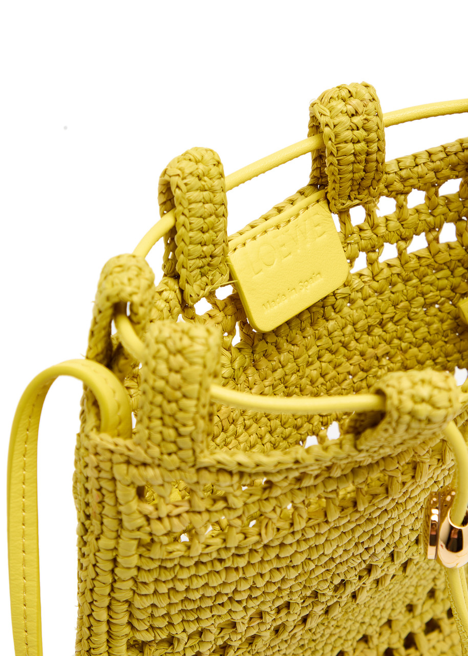 LOEWE X Paula's Ibiza Drawstring logo raffia pocket bag | Harvey
