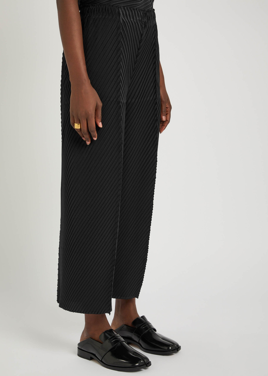 ISSEY MIYAKE Pleated crepe-plissé trousers | Harvey Nichols