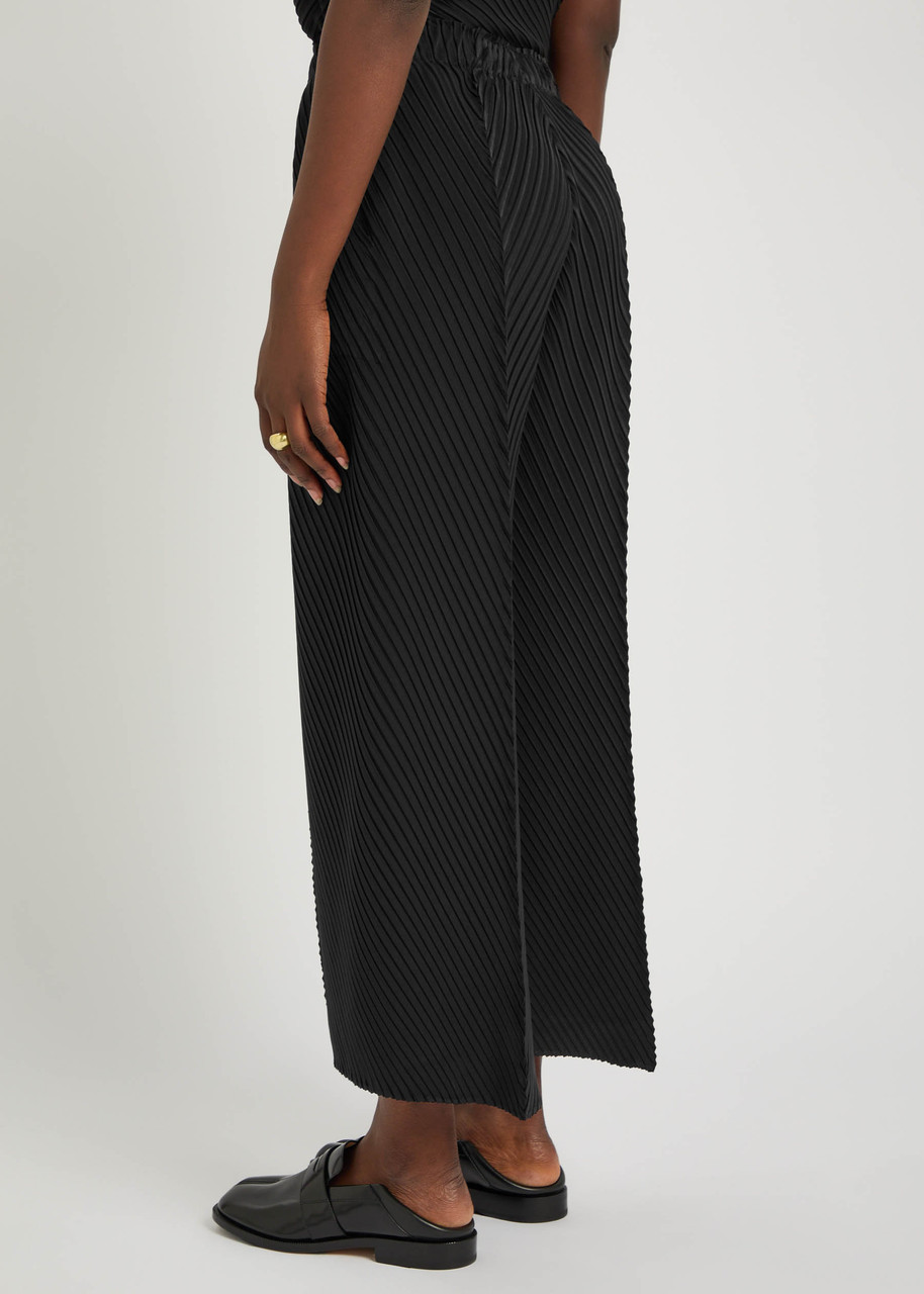 ISSEY MIYAKE Pleated crepe-plissé trousers | Harvey Nichols