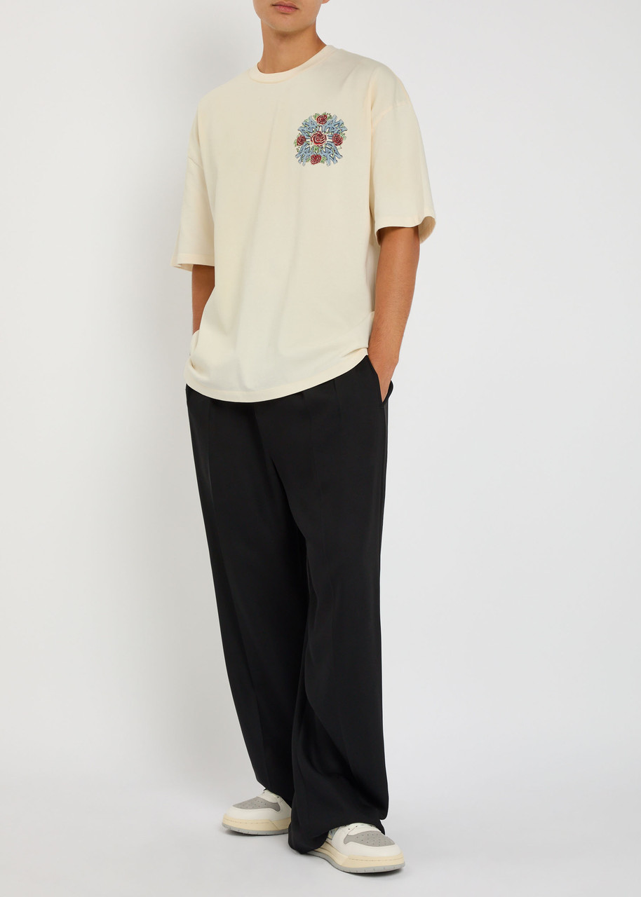 AMIRI Out For Trouble printed cotton T-shirt | Harvey Nichols