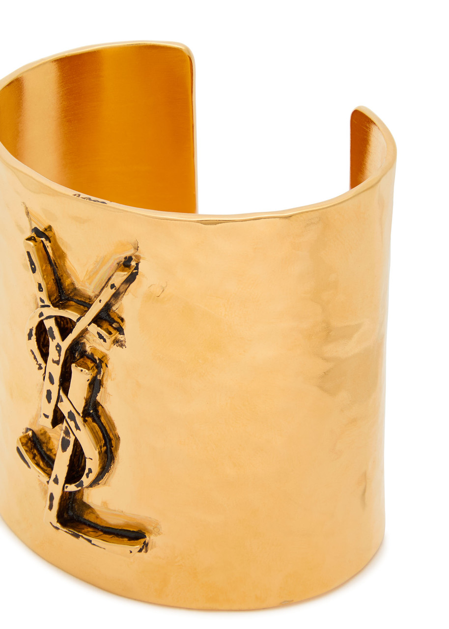 SAINT LAURENT Logo hammered cuff | Harvey Nichols