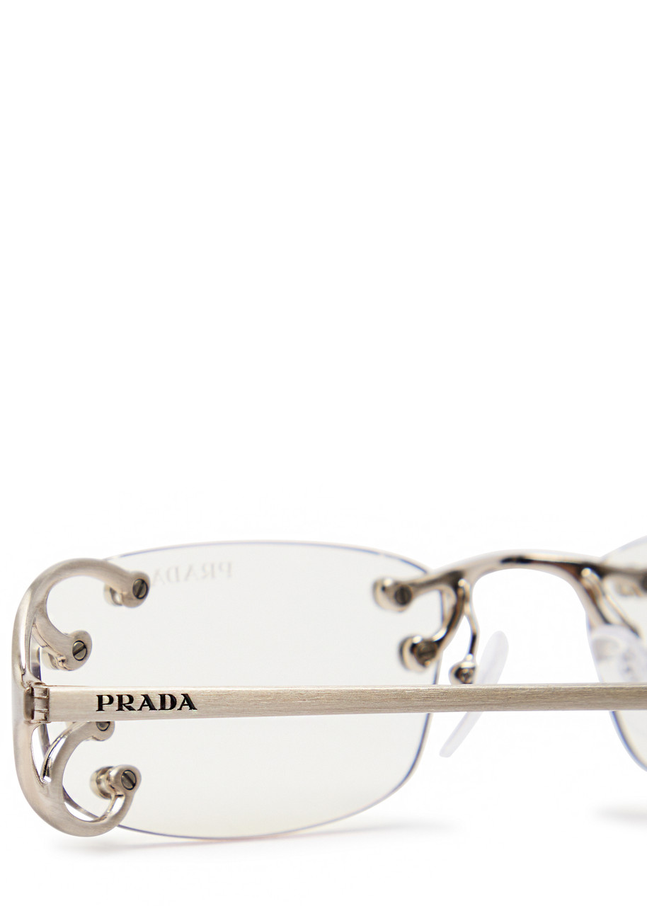 PRADA Narrow rimless sunglasses | Harvey Nichols