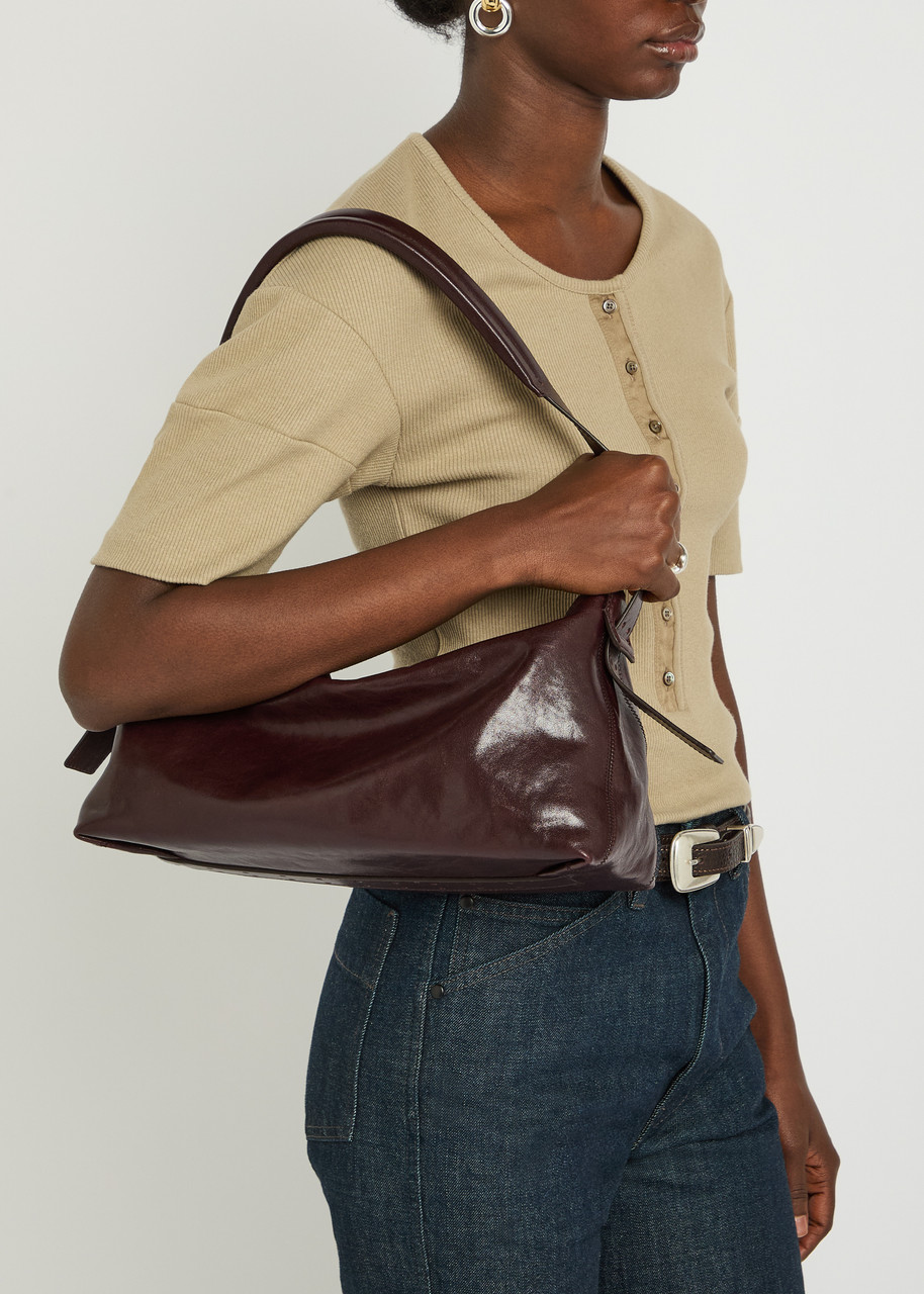 LEMAIRE Belted baguette leather shoulder bag | Harvey Nichols