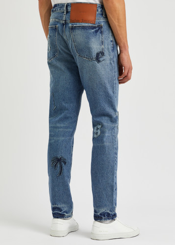 PALM ANGELS Logo-appliquéd distressed slim-leg jeans | Harvey Nichols