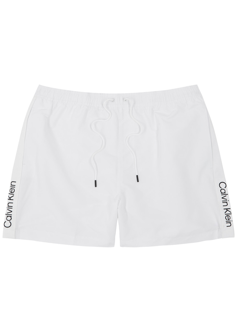 Shop Calvin Klein Logo Striped Shell Swim Shorts In White