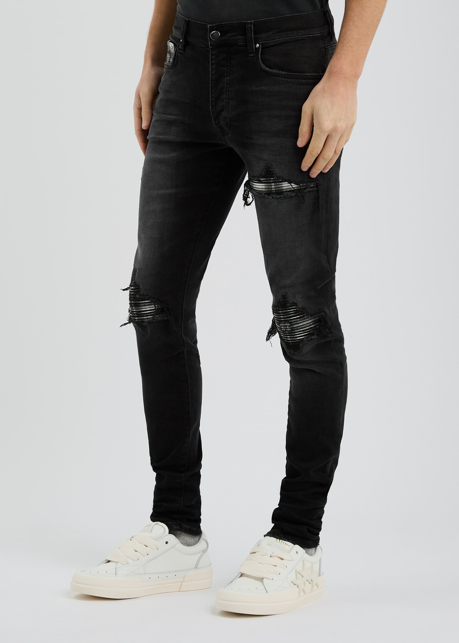 Amiri Slim Fit Distressed Trousers With Rivet Detailing In Black