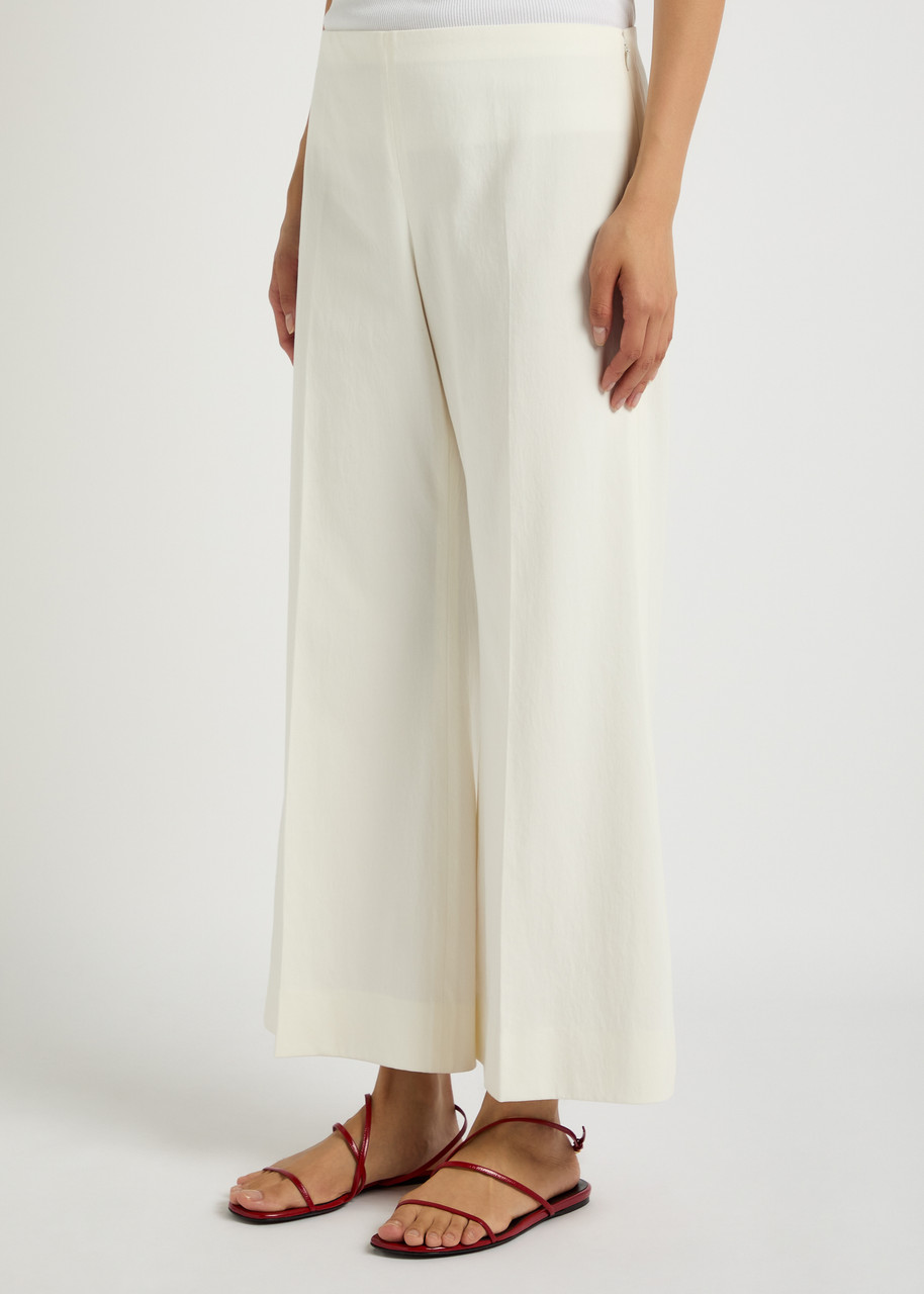 Khaite Walter Flared-leg Cotton Trousers In Pink