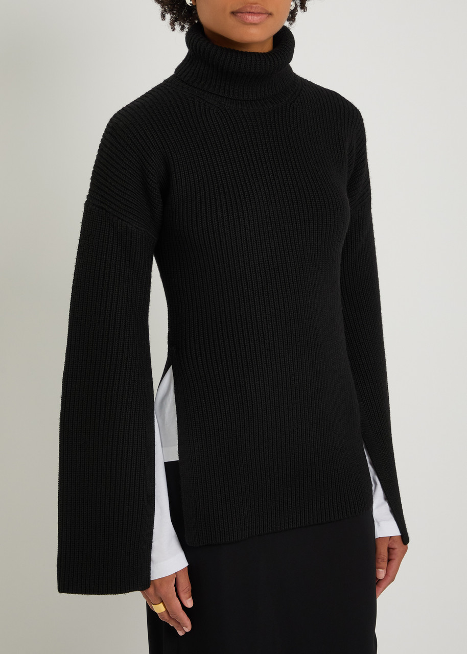Totême Toteme Slit Sleeve Ribbed Knit Jumper In Black