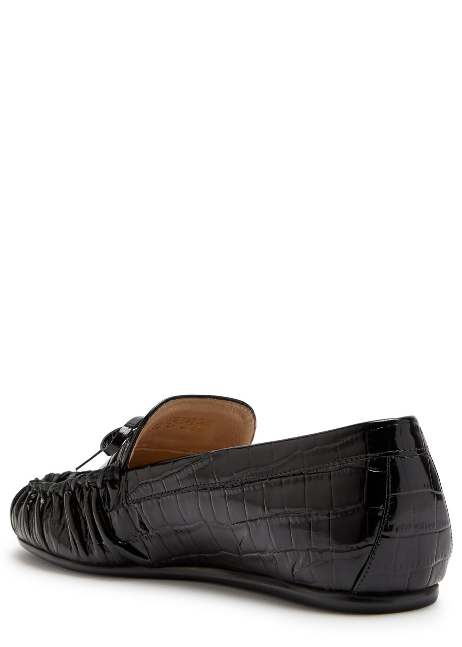 Stuart Weitzman Britt Bow Crocodile-effect Patent Leather Loafers In Black