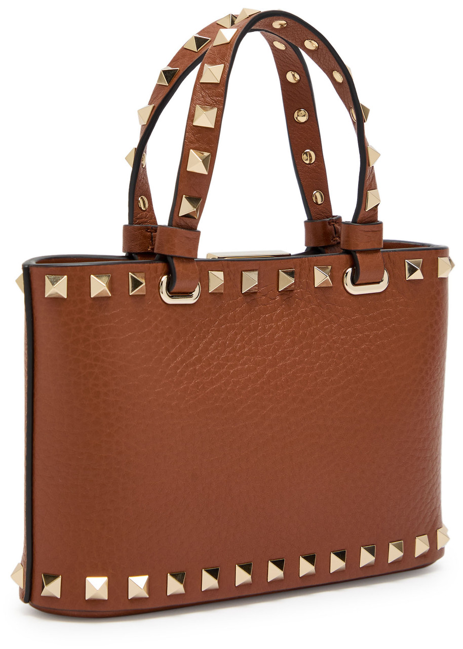 Valentino Garavani Rockstud Mini Grained Leather Top Handle Bag In Brown