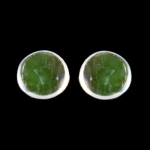 This trendy round Alaskan Jade is inlayed into a beautiful Sterling Silver earring.  These unique earrings have a post backing.  The diameter of the round mammoth tusk is approximately .29".