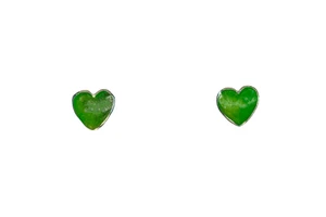 Small Heart Alaskan Jade Sterling Silver Cup Earring | F&F Inc.

This trendy small heart Alaskan Jade is inlayed into a beautiful Sterling Silver earring.  These different earrings have a post backing.  The measurements of the earrings are approximately .24" x .27".  The product ID is EJ-1006-S

Genuine Jade (nephrite) is a fascinating gemstone and the state gem of Alaska. In prehistoric times, prized for its toughness, jade was used to make weapons, tools and later simple ornaments. Jade purportedly can protect you from evil, attract love and of course bring you good luck. It is now regarded as a symbol of energy and beauty. Stimulating creativity and mental agility along with harmony and balance. The jade we use comes from the Nana Region of Alaska.

Enjoy your unique piece of history!

Features
Made in the USA!! 
Alaskan Jade
Sterling Silver
Heart Shaped
Post Backing
Lifetime Guarantee!!