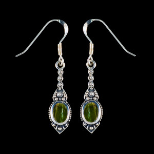 This chic small oval Alaskan Jade is inlayed into a stylish dangle Sterling Silver earring with french wire.  The measurements of the earrings are approximately .96" x .29".