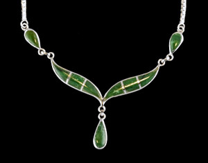 This unique whale tail with Teardrop Alaskan Jade shaped whale tail is inlayed into a sterling silver pendant.  This pendant comes with an 18" Sterling Silver chain.  The dimensions of the Alaskan Jade pendant is approximately 2.25" x 1.7".