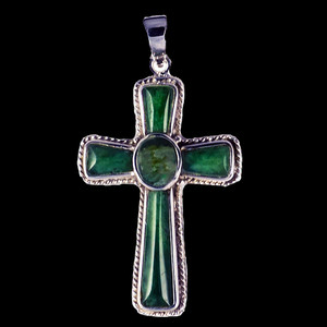 This striking large cross shaped Alaskan Jade piece is inlayed into a sterling silver pendant.  This pendant comes with an 18" Sterling Silver chain.  The dimensions of the Alaskan Jade pendant is approximately 1.23" x .79".