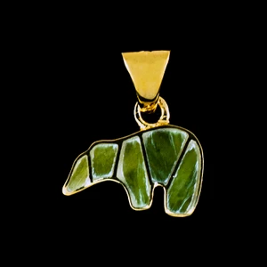Bear Alaskan Jade 14K Gold Pendant

This lovely bear shaped Alaskan Jade is inlayed into a 14K Gold pendant.  This pendant comes with an 18" 14K Gold chain.  The dimensions of the Alaskan Jade pendant is approximately 1" x .5".  The product id # is PJ-1071-G

It is a 14K plate on sterling silver. The plating is with 30mils of 14k gold. Typically plating is done with 3mils of gold. We work with the extra gold plating to ensure your beautiful jewelry piece will have a strong gold color for years to come!!  

Genuine Jade (nephrite) is a fascinating gemstone and the state gem of Alaska. In prehistoric times, prized for its toughness, jade was used to make weapons, tools and later simple ornaments. Jade purportedly can protect you from evil, attract love and of course bring you good luck. It is now regarded as a symbol of energy and beauty. Stimulating creativity and mental agility along with harmony and balance. The jade we use comes from the Nana Region of Alaska.