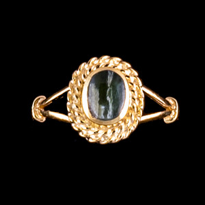 Oval Shaped Alaskan Jade with Rope Border 14K Gold Ring | F&F Inc.This breathtaking oval shaped Alaskan Jade design is inlayed into a elegant 14K Gold ring with a rope border.  The dimension of the stone on the ring is approximately .36" x .415".  The product id # is RJ-1017-G          This ring comes in the following sizes for the 14K Gold ring band.  Size 5, 6, 7, 8, 9 and 10