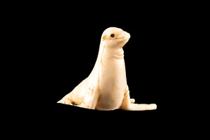 This is a beautiful hand carved eco-ivory Seal Statue.  The dimensions of the Seal Statue  are 1.63" x 1.29" x 1.48".  The SKU is C-5.

This unique Seal statue will make a great addition to any room in the house.  You can place it on a flat surface to diplay, or a great gift for children to lay with.

All statues are hand carved in clay.  We then make a mold of the original piece before producing them into the final acrylic resin product.
