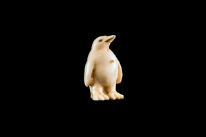 This is a beautiful hand carved eco-ivory Baby Penguin Statue.  The dimensions of the Baby Penguin Statue are 0.64" x 1.0" x .55".  The SKU is C-22.

This unique Baby Penguin Statue statue will make a great addition to any room in the house.  You can place it on any flat surface to diplay, or a great gift for children to have.

All statues are hand carved in clay.  We then make a mold of the original piece before producing them into the final acrylic resin product with an antique finish.