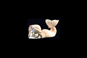 This is a charming hand carved eco-ivory Sleeping Mermaid Statue.  The dimensions of the Sleeping Mermaid Statue are 1.94" x 1.10" x .79.  The SKU is C-55.

This unique Sleeping Mermaid Statue statue will make a great addition to any room in the house.  You can place it on any flat surface to diplay, or a great gift for children to have.

All statues are hand carved in clay.  We then make a mold of the original piece before producing them into the final acrylic resin product with an antique finish.