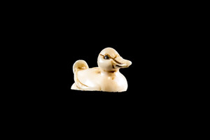 This is a detailed hand carved eco-ivory Mini Duck Statue  The dimensions of the Duck Statue are 0.55" x 0.58" x 1.18".  The SKU is C-19.  

This stunning Duck Statue will make a great addition to any room in the house.  You can place it on any flat surface to display, or a great gift for children to have.

All statues are hand carved in clay.  We then make a mold of the original piece before producing them into the final acrylic resin product with an antique finish.